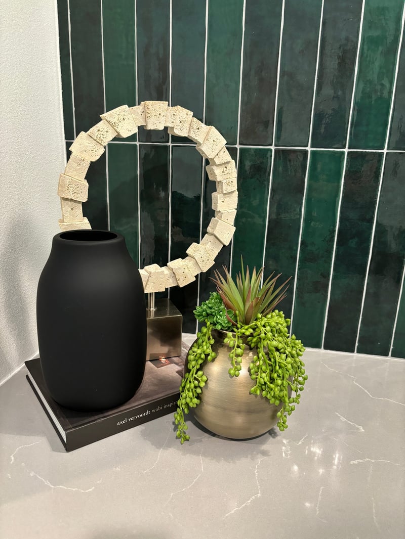 Small succulent arrangement styled on a vanity counter