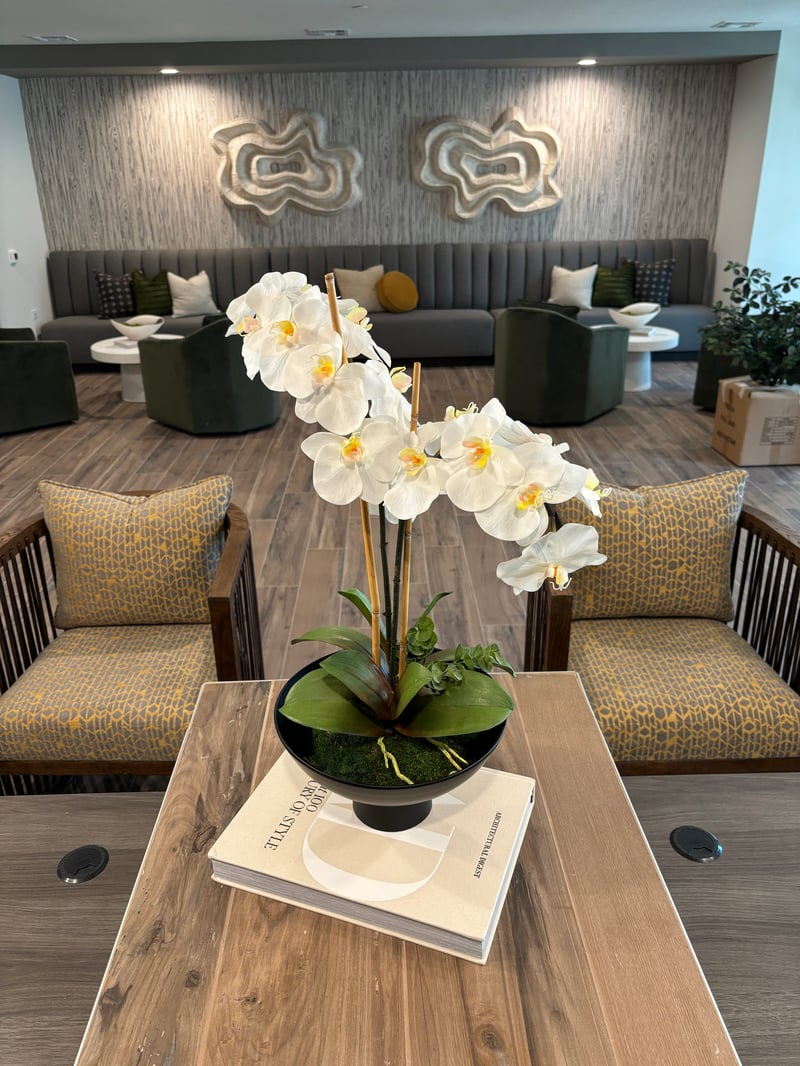 Wide view of the resident lounge with orchid centerpiece