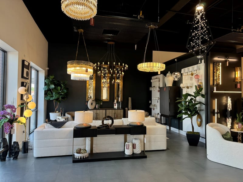 Two fiddle leaf figs flanking a showroom lighting display