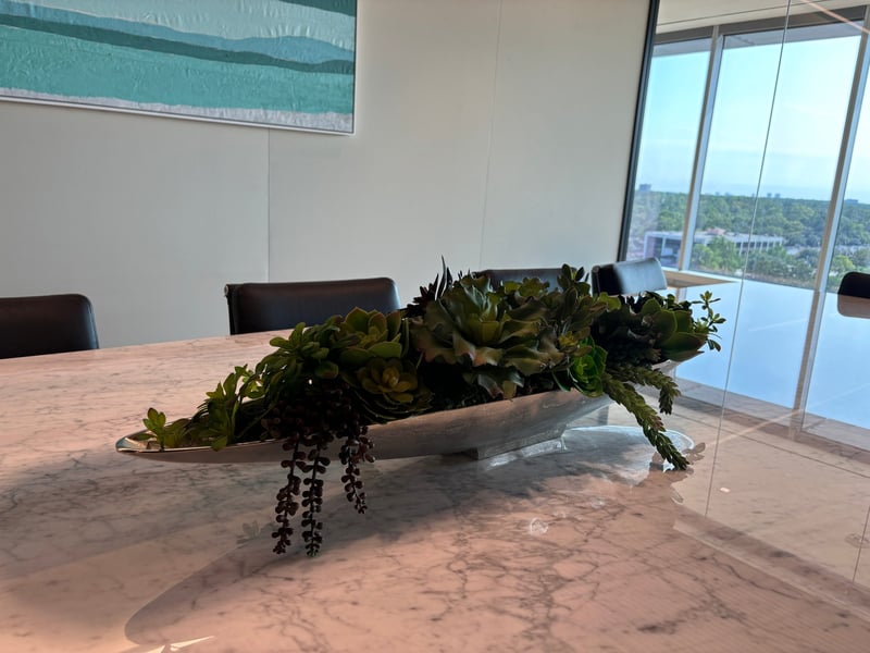 Succulent centerpiece in a silver boat planter